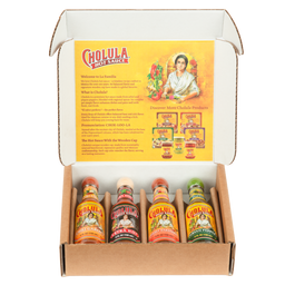 A cardboard gift box displays four different flavors of Cholula Hot Sauce: Chili Garlic, Extra Hot, Sweet Habanero, and Green Pepper.