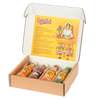 An open gift box displays a variety pack of Cholula Hot Sauce, featuring the Original, Extra Hot, Sweet Habanero, and Green Pepper flavors.