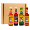 Four bottles of Cholula Hot Sauce in Original, Extra Hot, Green Pepper, and Sweet Habanero flavors are lined up in front of a cardboard box.