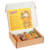 An open cardboard gift box displays four different bottles of Cholula Hot Sauce: Original, Extra Hot, Sweet Habanero, and Green Pepper, with promotional text on the inside of the lid.