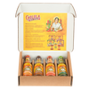 An open gift box displays a Cholula Hot Sauce Variety Pack, featuring Chili Garlic, Chipotle, Sweet Habanero, and Green Pepper flavors, with an informational insert about the brand's history.
