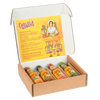 An open gift box of the Cholula Hot Sauce Variety Pack displays four different flavors-Chili Garlic, Chipotle, Sweet Habanero, and Green Pepper-against a black background.