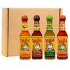 Four bottles of Cholula Hot Sauce in the flavors Chili Garlic, Chipotle, Green Pepper, and Sweet Habanero are arranged in a row in front of a cardboard box.