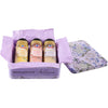 A gift set featuring McCormick Bridgerton finishing sugars, including Sweet Lemon, Strawberries &amp; Cream, and Lavender Vanilla flavors, presented in a decorative tin.