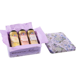 A Bridgerton by McCormick gift set includes Sweet Lemon, Strawberries &amp; Cream, and Lavender Vanilla finishing sugars in a decorative tin.