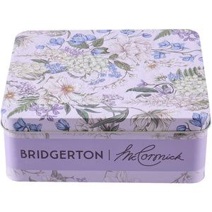 A Bridgerton McCormick tin box with a floral design.