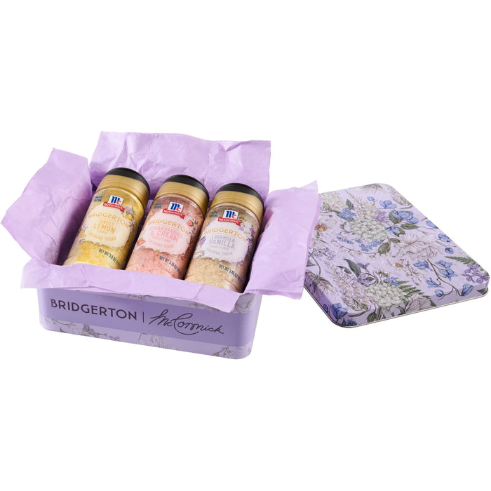 A gift set featuring McCormick Bridgerton finishing sugars, including Sweet Lemon, Strawberries &amp; Cream, and Lavender Vanilla flavors, presented in a decorative tin.