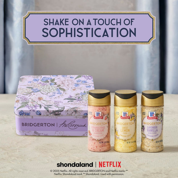 A collection of McCormick's Bridgerton finishing sugars, including Strawberries &amp; Cream, Sweet Lemon, and Lavender Vanilla, are displayed with a Bridgerton-themed tin.