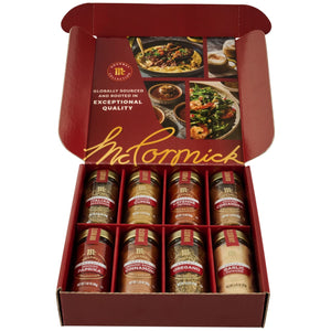 The Gourmet Bundle Best Sellers Dtcmckvb from McCormick is displayed in an open red gift box, showcasing eight organic spices: Italian Seasoning, Ground Cumin, Cayenne Pepper, Ground Coriander, Smoked Paprika, Ground Saigon Cinnamon, Oregano, and Garlic Powder.