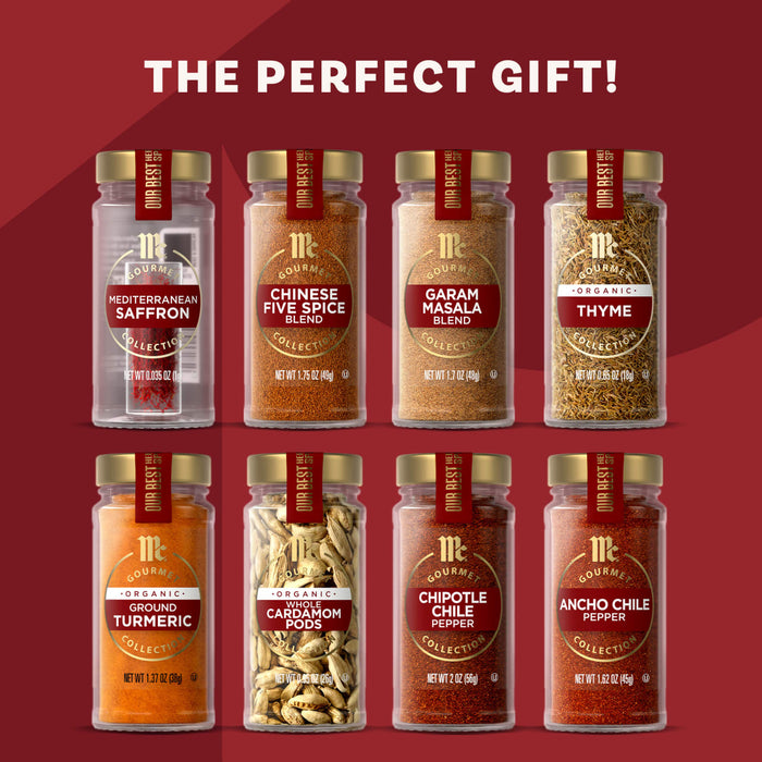 Eight jars of McCormick Gourmet spices, including Saffron, Chinese Five Spice, and Turmeric, are arranged in two rows to showcase the variety in the Mkc Gourmet Global Exploration Bundle Count, presented as the perfect gift.
