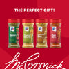 A promotional image of the Mccormick Dtc Blends Bundles Innovative shows four Signature Seasonings bottles-Chimichurri, Garlic &amp; Olive Oil, Caramelized Onion, and Chili Garlic-lined up against a red background with the text, The Perfect Gift.