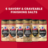 Six different bottles of McCormick Finishing Salts are lined up in a promotional image under the text 6 Savory &amp; Craveable Finishing Salts.