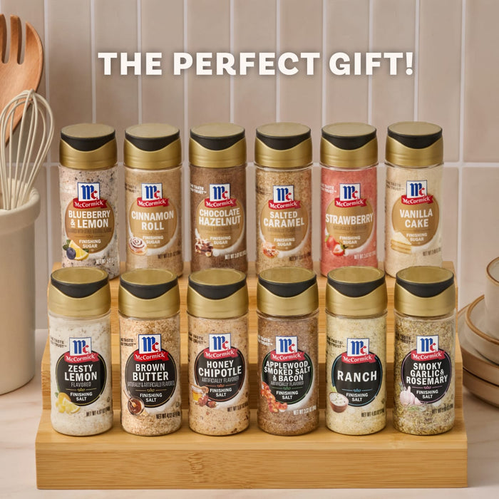 A two-tiered wooden spice rack displays a collection of McCormick Finishing Sugars and Finishing Salts, presented as the perfect gift idea.