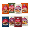 An assortment of eight McCormick seasoning mix packets, including Original Taco, Beef Stew, and Original Chili, are displayed in two rows, showcasing the variety in the Dtcmckvbeasymealsdrmbundle.