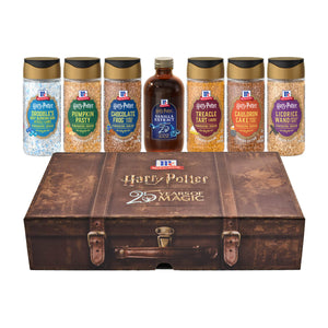 A Dtcmckvb Harry Potter X Mccormick Back To Hogwarts Finishing Sugars And Extract Trunk Bundle featuring a decorative brown trunk and six themed bottles including vanilla extract and various flavored finishing sugars like Pumpkin Pasty and Chocolate Frog.