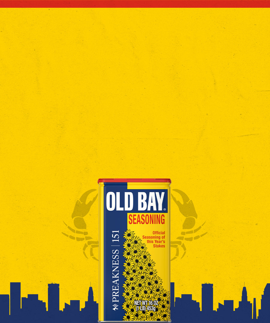 Old Bay seasoning can on a yellow background with city skyline silhouette
