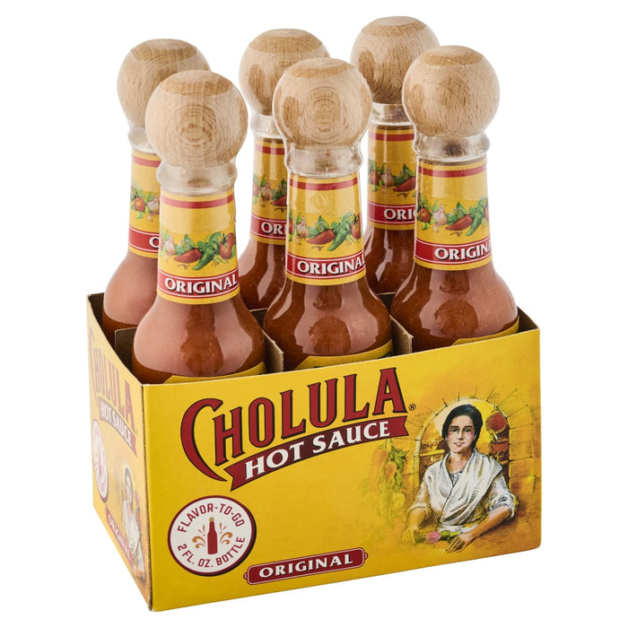 A six-pack of Cholula Hot Sauce bottles in its branded cardboard packaging.