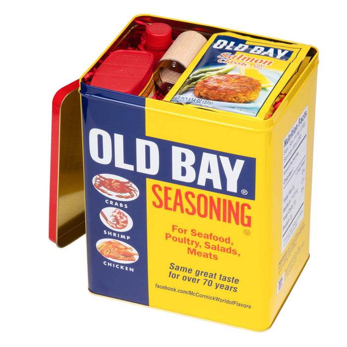 A yellow tin of Old Bay Seasoning with a red lid and a picture of a crab shrimp and chicken on the side.