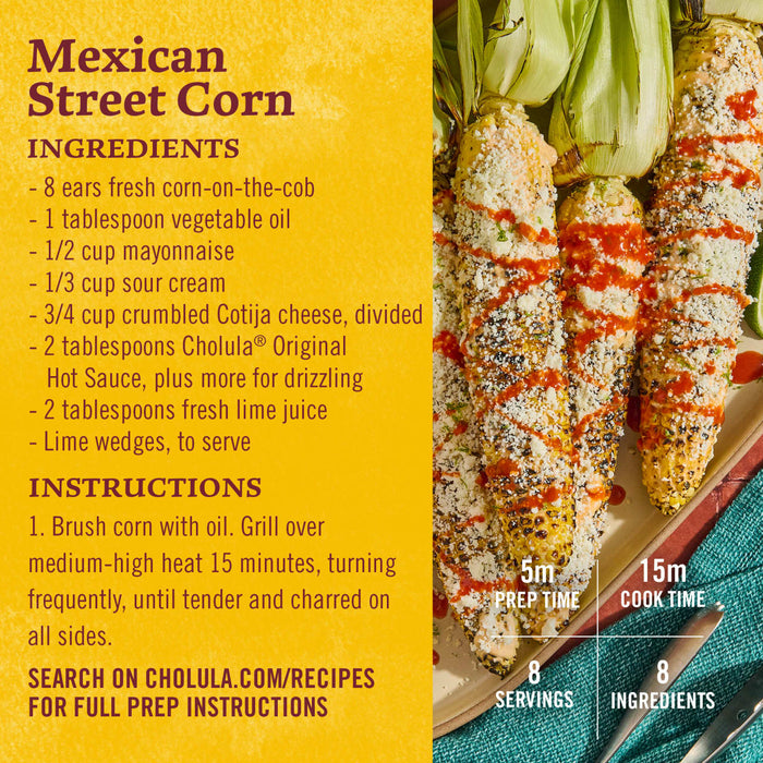 Grilled Mexican street corn with Cholula hot sauce, cotija cheese, and lime wedges.