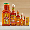 Six bottles of Cholula Original Hot Sauce in different sizes from a small packet to a large bottle.