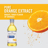 A bottle of McCormick Culinary Pure Orange Extract with a bright orange slice and orange zest.