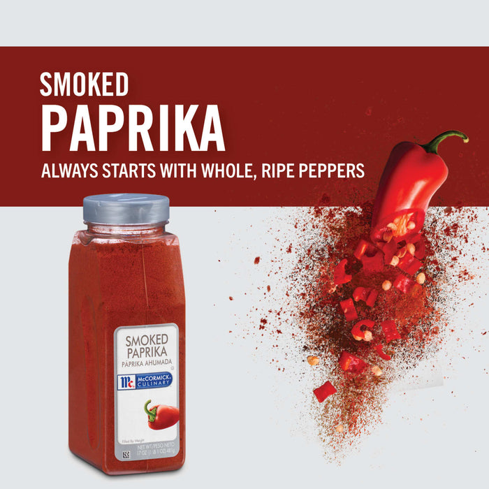 A jar of McCormick Culinary Smoked Paprika with a red pepper falling apart into pieces.