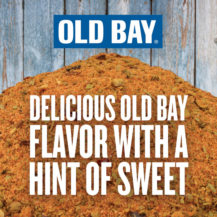 A close-up of Old Bay seasoning with the text Delicious Old Bay Flavor with a Hint of Sweet.