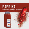 A jar of McCormick Culinary Paprika with a red pepper and paprika powder spilling out.