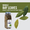 A jar of McCormick Culinary Whole Bay Leaves hand-selected from Turkey with bay leaves scattered around it.