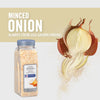 A jar of McCormick Culinary Minced Onion with a whole onion and onion peels in the background.