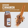 A jar of McCormick Culinary Ground Cinnamon with cinnamon sticks and powder scattered around it.