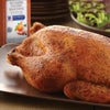 A roasted chicken seasoned with McCormick Culinary Rotisserie Chicken Seasoning.