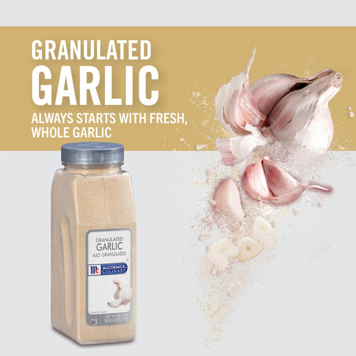 A jar of McCormick Culinary Granulated Garlic with fresh garlic cloves around it.