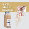 A jar of McCormick Culinary Minced Garlic with whole garlic cloves in the background.