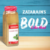 A jar of Zatarain\s Gumbo FilAC seasoning sits in front of a blue wooden background with the words BOLD Like that in white and pink.