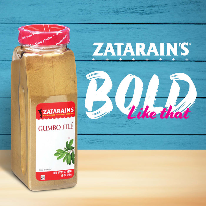 A jar of Zatarain\s Gumbo FilAC seasoning sits in front of a blue wooden background with the words BOLD Like that in white and pink.