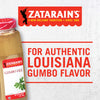 A Zatarain\s Gumbo File seasoning jar with a red and white label and a red background with the words For Authentic Louisiana Gumbo Flavor.