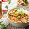 A bowl of Zatarains Gumbo File with shrimp rice and green onions.