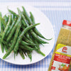 A plate of green beans seasoned with Lawrys Salt-Free Garlic &amp; Herb Seasoning.