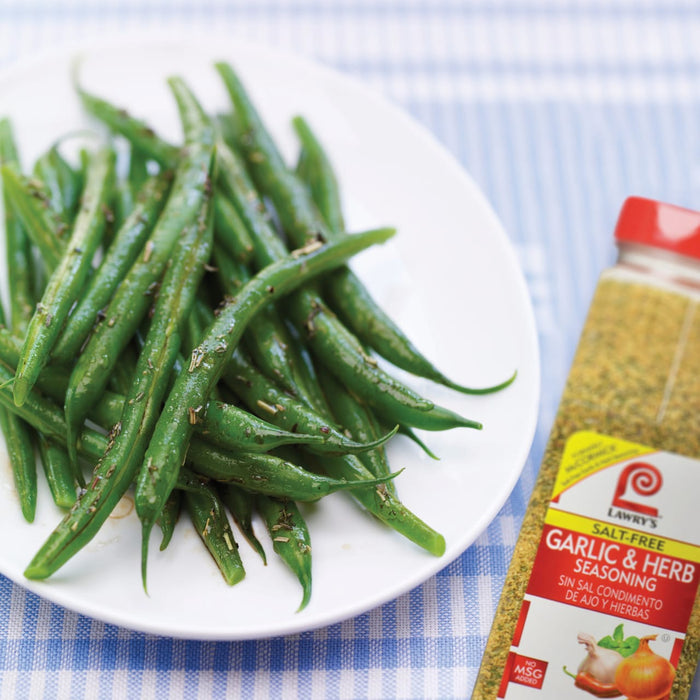 A plate of green beans seasoned with Lawrys Salt-Free Garlic &amp; Herb Seasoning.