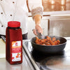 A chef is cooking chicken wings with Lawrys Mango Habanero Wings Seasoning Mix.