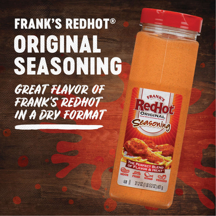 A jar of Franks RedHot Original Seasoning on a wooden background.