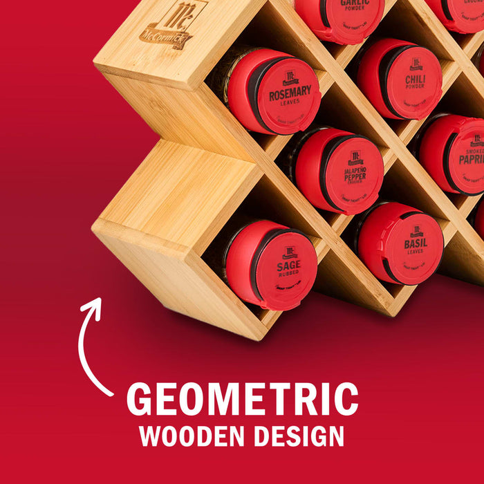 A geometric wooden spice rack holds red spice containers.