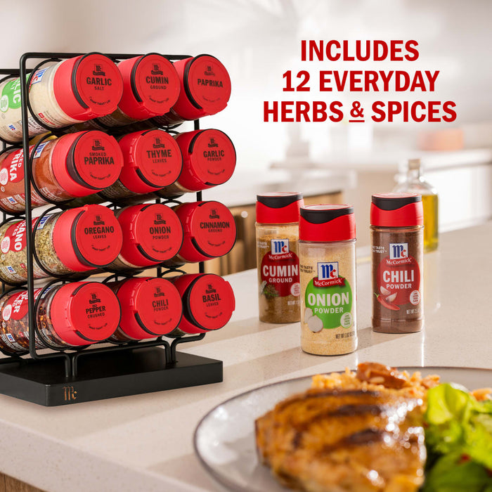 A McCormick spice rack with 12 everyday herbs and spices is displayed on a kitchen counter.
