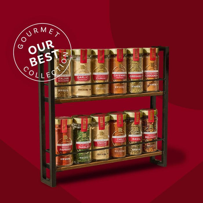 A spice rack filled with Gourmet Collection spices is displayed against a red background, highlighted with an Our Best Collection badge.