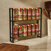 A two-tiered spice rack filled with McCormick spices sits on a countertop.