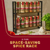 A two-tier space-saving spice rack filled with various spices is displayed on a kitchen counter.