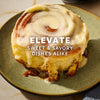 A delicious cinnamon roll with creamy frosting, perfect for elevating both sweet and savory dishes.