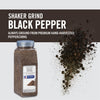 A container of McCormick Culinary Shaker Grind Black Pepper with peppercorns scattered around it.