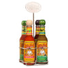 A metal caddy holds four bottles of Cholula Hot Sauce in various flavors including Original and Green Pepper featuring the iconic wooden caps and brand logo.